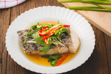 Steam fish with delicious sauce close up