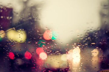 Water rain on car window. vintage filter