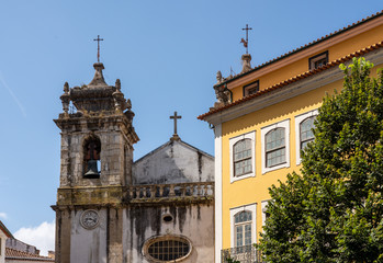Obraz premium Old church tower of Sao Bartholomeu church in downtown Coimbra in Portugal