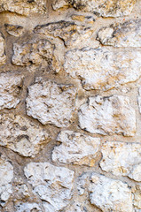 Multicolored abstract illustration on an old stone wall. Natural background concept