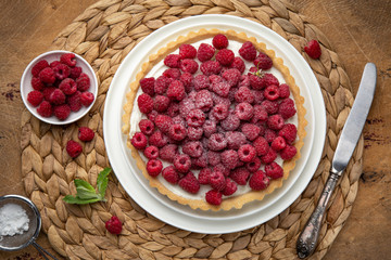 raspberry tart  on wooden table