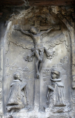 An old crucifixion relief sculpture outside St. Stephen's Cathedral in Vienna, Austria