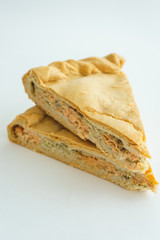 piece of cake with fish filling on a white background.