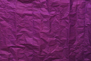 Purple crumpled paper texture background. Top view