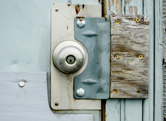Door knob background on wooden door close up