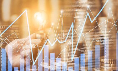 Multi exposure of glowing lamp, financial chart and stacks of money