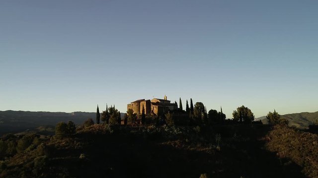 4K drone footage of small romanic hermitage of the 16th century in Gratallops,  a small town of Catalonia, at sunset