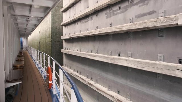 Wallsee-Mitterkirchen Lock. Ship leaving the sluice very close to the wall