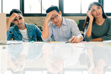 stressful Business people sitting in meeting room with boring and headache