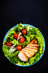 Caesar salad on stone table