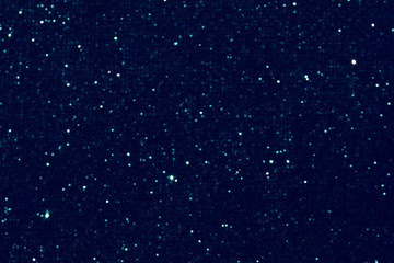 background of abstract glitter lights. blue and black. de focused