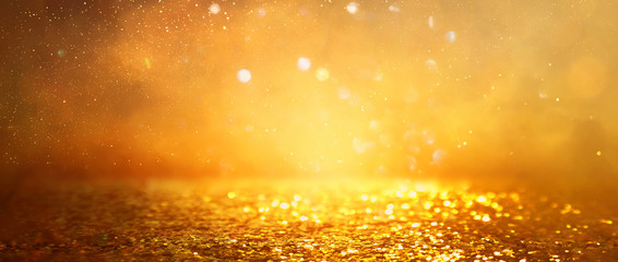 background of gold glitter lights. de focused