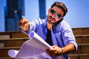 civil engineer working with documents at construction site.engineers working at building site. 
