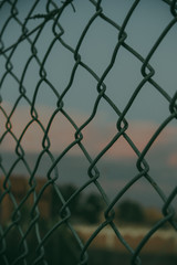 Fototapeta premium chain link fence with barbed wire