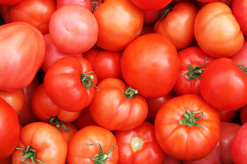 Fresh ripe red tomatoes. Close-up. Top view. Background. Texture.