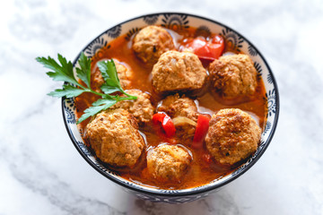 Pork and beef meatballs in tomato and paprika sauce