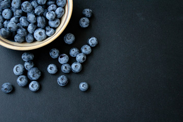 Blueberries on the black background