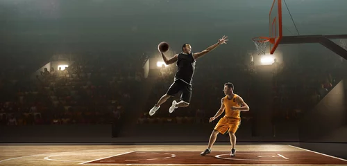 Zelfklevend Fotobehang Two basketball players in action fighting for the ball near hoop © TandemBranding