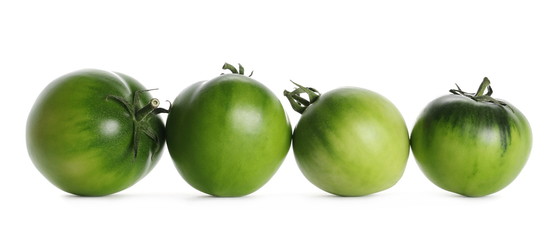 Set fresh green unripe tomatoes isolated on white background