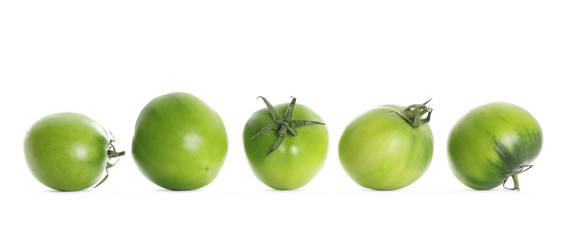 Set fresh green unripe tomatoes isolated on white background