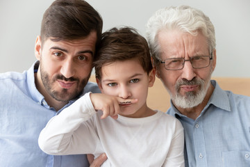 Happy funny three generation men family close up portrait