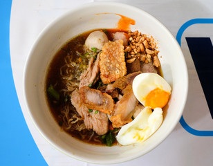 Noodle with Marinated Pork, Deep fried crispy pork skin, and egg.