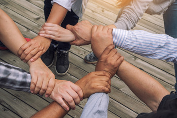 Membership ogetherness Collaboration and success Concept .People putting their hands together show power . Friends with stack of hands showing unity and teamwork