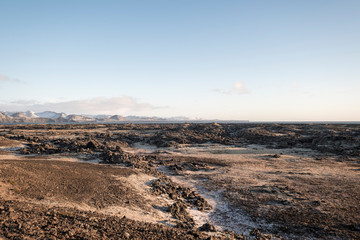 Lavafeld am Leuchtturm Hopsnesviti bei Grindavik an der Küste der Halbinsel Reykjanes