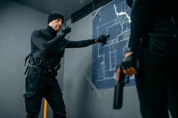 Gangsters getting ready for the bank vault robbery
