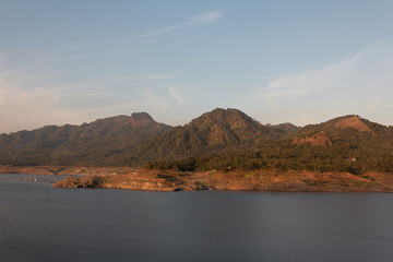 Fototapeta na wymiar Panorama, mountains above the sea with blue sky background