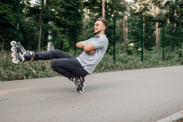 Roller skating, male teenager rolling in park