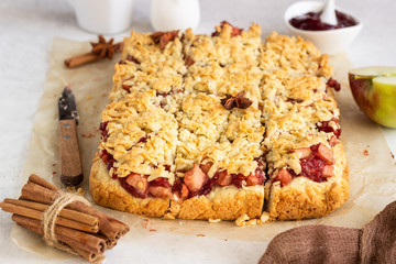 Crumble cakes with apple, red berry jam and spices filling and a cup of coffee. Autumn breakfast or dessert.