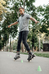 Roller skating, skater rolling around the cones