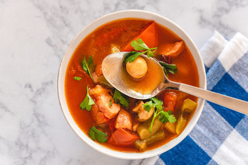 Letcho with yellow and red pepper, zucchini, tomatoes and mushrooms served in a bowl
