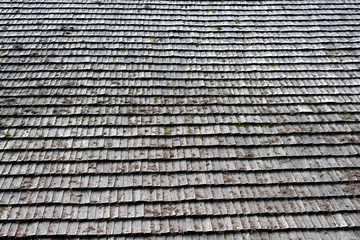 Old roof made of gray wooden planks. Backgrounds and textures