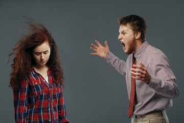 Man shouts on woman, strong wind blowing in face
