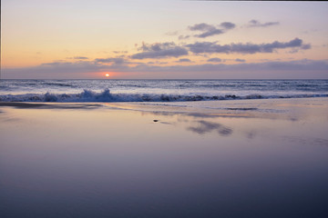 Sunset on the beach of Rostro. Finisterre Galicia, Spain. This beach is one of the stages of the lighthouse way that goes from Malpica to Finisterre along 200km in the Costa da Morte.