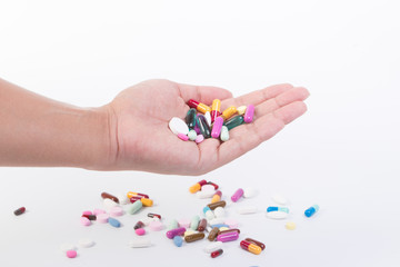 man holding pills on hand medicine health care concept on white background