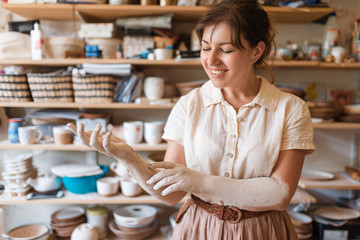 Female master hands covered with clay, pottery