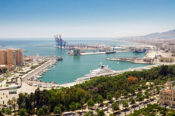 Obraz na płótnie Canvas Cityscape of Malaga with mediterranean sea port harbor. Andalusia, Spain .