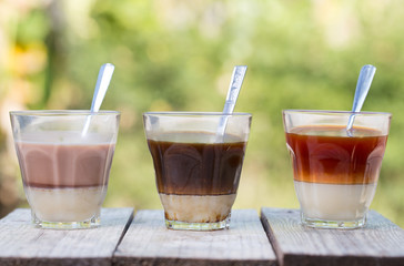 Hot drink, thai hot tea, hot black coffee, hot cocoa signature local street beverage on wooden table