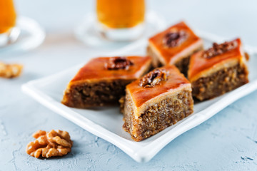 walnut baklava with glasses of tea