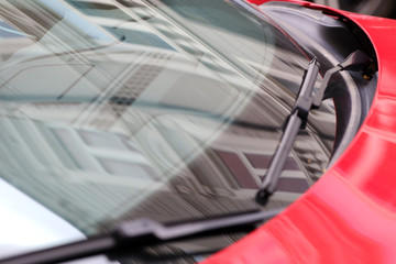 Buildings reflected onto cars