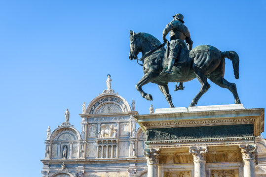 Statue of Bartolomeo Colleoni, Venice, Italy. Renaissance monument of 15th century on Campo Santi Giovanni in central Venice. Old square of Venice in summer. Medieval statue rises over Venice.