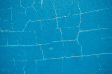 Blue wall cracking background. 