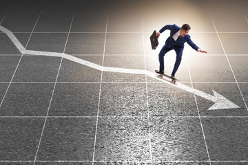 Businessman riding skateboard on financial graph