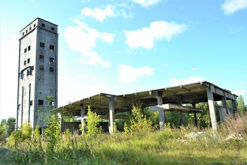 Obraz premium Russia, Nizhny Novgorod region,29.08.2019 year .Old abandoned Elevator (granary).Gray tower.rey old wall with empty window