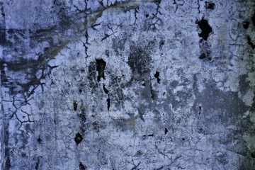 The background of the crack wall is blue .Texture. 