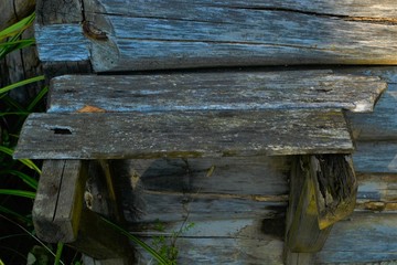 very old and ruined wooden bench gray