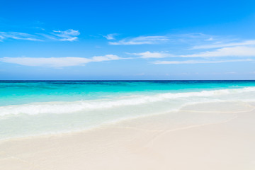 Fototapeta na wymiar beach white sand and blue sky in thailand